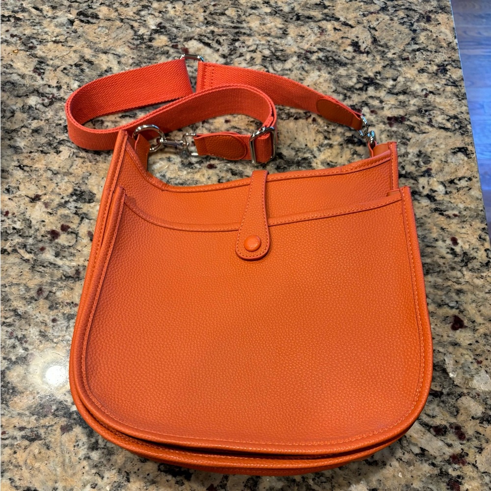 Beautiful orange Crossbody messenger bag, never used brand new! Includes strap!